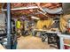 Unfinished basement featuring exposed brick and a variety of shelving for storage and utility at 210 Dutchess Dr, Cary, NC 27513