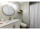 Bathroom featuring updated vanity, rounded mirror, and a bathtub-shower combo at 210 Dutchess Dr, Cary, NC 27513