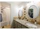 Bright bathroom with double vanity, decorative tile backsplash, and a shower-tub combo at 210 Dutchess Dr, Cary, NC 27513