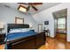 Comfortable bedroom with natural light, ceiling fan, and a cozy window seat at 210 Dutchess Dr, Cary, NC 27513