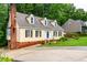 Well-maintained home with updated siding and a brick chimney at 210 Dutchess Dr, Cary, NC 27513