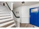Inviting foyer with staircase and decorative touches at 210 Dutchess Dr, Cary, NC 27513
