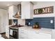 Bright kitchen featuring white cabinets, subway tile backsplash, and stainless steel range at 210 Dutchess Dr, Cary, NC 27513