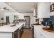 Spacious kitchen with white cabinets, stainless steel appliances, and a large island with a farmhouse sink at 210 Dutchess Dr, Cary, NC 27513