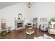 Cozy living room with a stone fireplace and natural light at 210 Dutchess Dr, Cary, NC 27513