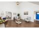 Spacious living room featuring a vaulted ceiling and hardwood floors at 210 Dutchess Dr, Cary, NC 27513