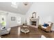 Bright and airy living room with hardwood floors and a skylight at 210 Dutchess Dr, Cary, NC 27513