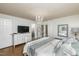 Comfortable main bedroom featuring hardwood floors, a chandelier, and a private outdoor entrance at 210 Dutchess Dr, Cary, NC 27513