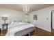 Cozy main bedroom with hardwood floors, chandelier, and comfortable seating at 210 Dutchess Dr, Cary, NC 27513