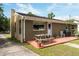 Backyard featuring patio, grill, mature trees, and partial grass at 2125 Cheek Rd, Durham, NC 27704