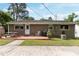 Backyard featuring patio, grill, mature trees, and partial grass at 2125 Cheek Rd, Durham, NC 27704