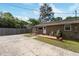 Backyard featuring patio, grill, mature trees, and partial grass at 2125 Cheek Rd, Durham, NC 27704