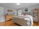 Bedroom with hardwood floors, natural light and a decorative accent wall at 2125 Cheek Rd, Durham, NC 27704