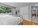 Bright bedroom featuring hardwood floors, closet, and ample natural light at 2125 Cheek Rd, Durham, NC 27704