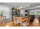 Open dining area featuring hardwood floors, and views to the kitchen and living room at 2125 Cheek Rd, Durham, NC 27704