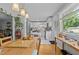Bright kitchen with white cabinets and views to the dining area and backyard at 2125 Cheek Rd, Durham, NC 27704