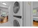 Laundry area featuring stackable washer and dryer and tile flooring at 2125 Cheek Rd, Durham, NC 27704