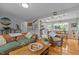 Inviting living room with hardwood floors, comfortable seating, and an open view into the dining area at 2125 Cheek Rd, Durham, NC 27704