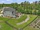 Spacious backyard with a stream, patio, hot tub, and mature trees at 213 Lofty Oak Ln, Holly Springs, NC 27540