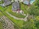 An expansive backyard with stream, fire pit, patio, and plenty of green space at 213 Lofty Oak Ln, Holly Springs, NC 27540