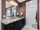 Modern bathroom with granite countertop vanity and stylish fixtures at 213 Lofty Oak Ln, Holly Springs, NC 27540