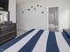 This bedroom has decorative accents and leads to the bathroom at 213 Lofty Oak Ln, Holly Springs, NC 27540