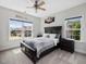 Comfortable bedroom with carpet, ceiling fan and lots of natural light at 213 Lofty Oak Ln, Holly Springs, NC 27540
