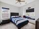 Charming bedroom features a ceiling fan and window seat at 213 Lofty Oak Ln, Holly Springs, NC 27540