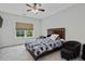 Cozy bedroom with a wooden framed bed and a side chair at 213 Lofty Oak Ln, Holly Springs, NC 27540