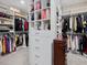 Spacious walk-in closet with custom shelving and ample storage space at 213 Lofty Oak Ln, Holly Springs, NC 27540