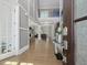 Bright foyer featuring an elegant staircase, hardwood floors, and views into the living area at 213 Lofty Oak Ln, Holly Springs, NC 27540