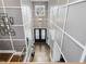 Dramatic two story foyer with hardwood floors, chandelier, and elegant decorations at 213 Lofty Oak Ln, Holly Springs, NC 27540