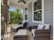 Cozy porch featuring comfortable seating, perfect for enjoying the outdoors and the neighborhood views at 213 Lofty Oak Ln, Holly Springs, NC 27540