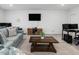 Large living room has plenty of seating and an entertainment center at 213 Lofty Oak Ln, Holly Springs, NC 27540