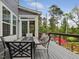 Outdoor seating area with a view of the surrounding trees at 213 Lofty Oak Ln, Holly Springs, NC 27540