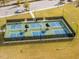 Aerial view of outdoor pickleball courts with benches and lighting, perfect for active community living at 213 Lofty Oak Ln, Holly Springs, NC 27540