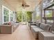 Sunroom with comfortable seating and plenty of natural light at 213 Lofty Oak Ln, Holly Springs, NC 27540