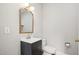 Small bathroom with mirror, wall lighting, and small vanity at 2209 The Circle, Raleigh, NC 27608