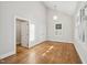 A light filled bedroom with hardwood floors and vaulted ceilings at 2209 The Circle, Raleigh, NC 27608