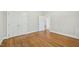 Bedroom features hardwood floors, double closets, and white trim at 2209 The Circle, Raleigh, NC 27608