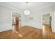 The formal dining room has hardwood floors, chair rails and modern lighting at 2209 The Circle, Raleigh, NC 27608