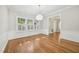 Dining room featuring hardwood floors, white wainscoting, and ample natural light at 2209 The Circle, Raleigh, NC 27608