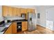 The kitchen is fully equipped with stainless steel appliances and plenty of cabinet space at 2209 The Circle, Raleigh, NC 27608