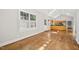 Bright kitchen with hardwood floors, ample sunlight, and modern appliances under a vaulted ceiling at 2209 The Circle, Raleigh, NC 27608