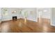 Hardwood floors accent a light filled living room with fireplace and multiple entryways at 2209 The Circle, Raleigh, NC 27608
