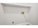 Simple white wall with access panel to utility connections and a shelf at 2209 The Circle, Raleigh, NC 27608
