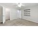 A bedroom with neutral walls, carpeted floors, a ceiling fan, access to a closet, and shelving at 2309 Filigree Ct, Raleigh, NC 27614