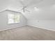 Bonus room with bright natural light, neutral paint, and plush patterned carpet at 2309 Filigree Ct, Raleigh, NC 27614