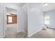 Hallway view of a large bedroom showcasing natural light from two windows at 2309 Filigree Ct, Raleigh, NC 27614