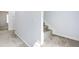 Hallway with light blue walls and carpeted floors, leading to other parts of the home at 2309 Filigree Ct, Raleigh, NC 27614